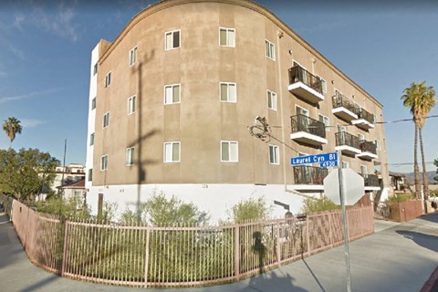 a building with a street sign in front of it