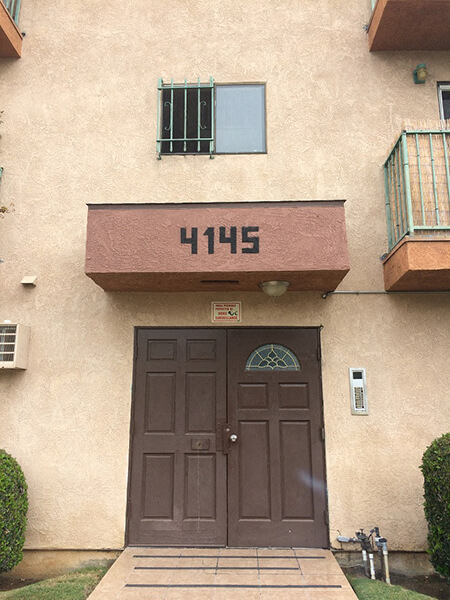 a building with a brown door and a window