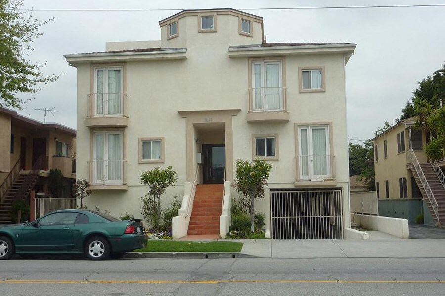a car is parked in front of a house