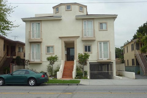 a car is parked in front of a house