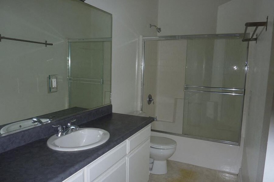 a bathroom with a sink toilet and a shower