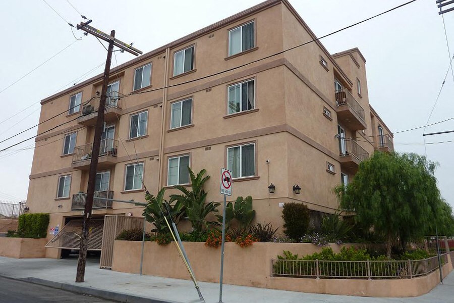 a building with a street sign in front of it
