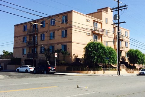 an apartment building on the corner of a street