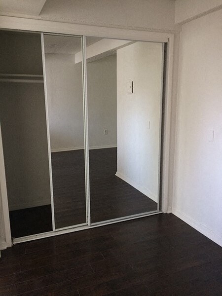 an empty room with sliding glass doors