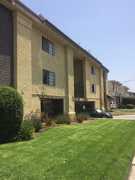 a building with a green lawn in front of it