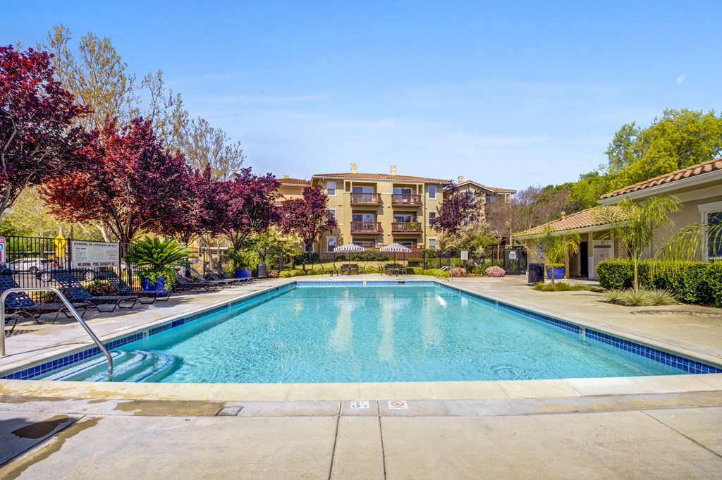 a swimming pool with trees and a building in the background  at Cornerstone at Gale Ranch, California, 94582