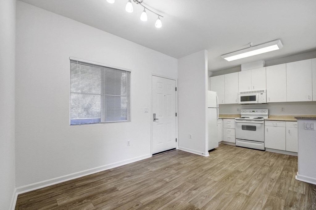a kitchen with white cabinetry and a wooden floor  at Cornerstone at Gale Ranch, San Ramon, CA