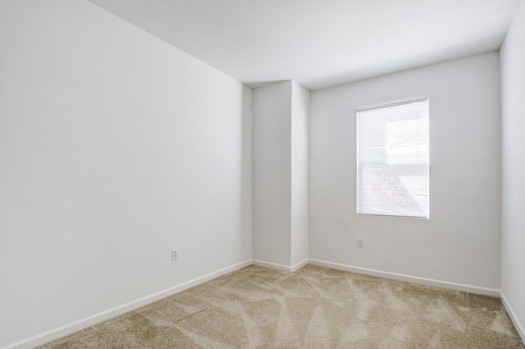a bedroom with white walls and carpet  at Cornerstone at Gale Ranch, California, 94582