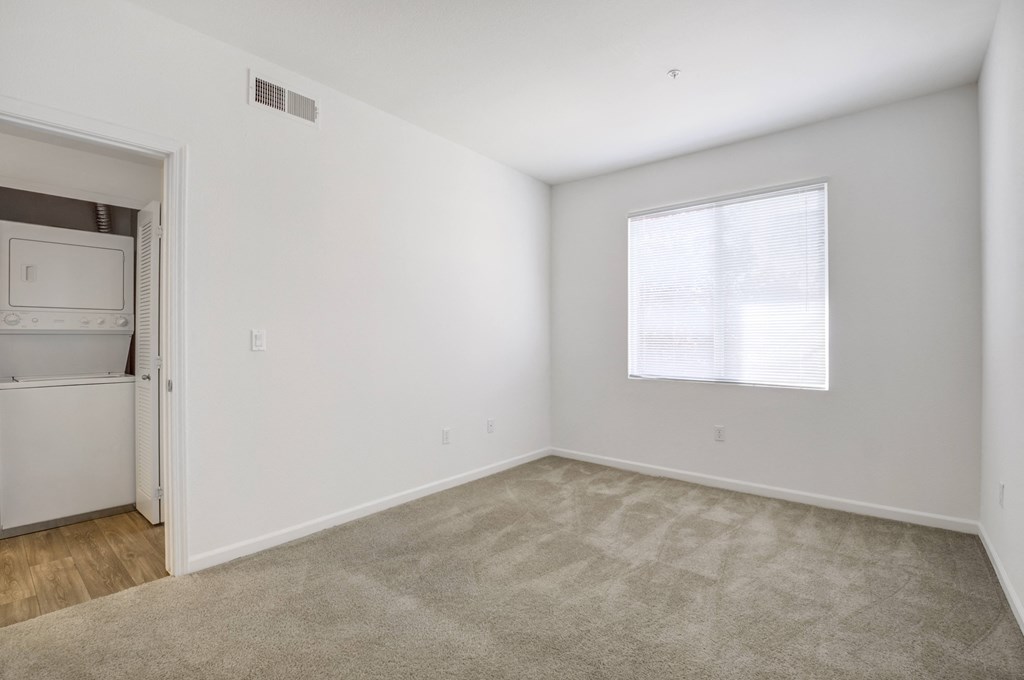 a bedroom with white walls and carpet  at Cornerstone at Gale Ranch, San Ramon