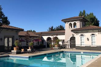 a house with a swimming pool in front of it  at Falcon Bridge at Gale Ranch, San Ramon, CA