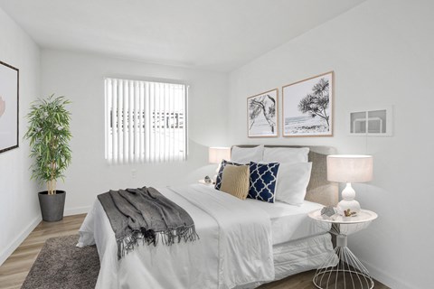 Bedroom with white walls and white bedding at Harvard Manor, Irvine, 92612