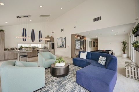 a living room filled with furniture and a large window  at Laguna Gardens Apts., Laguna Niguel, CA