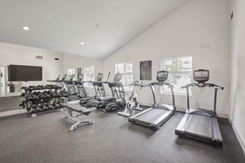 gym with cardio equipment at the bradley braddock road station apartments  at Laguna Gardens Apts., California, 92677