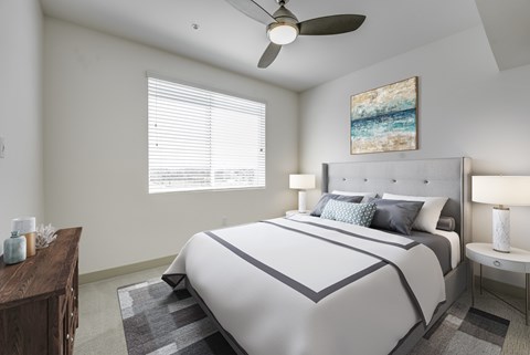 A bedroom with a large bed and a ceiling fan at Montecito at Carlsbad, Carlsbad, CA 92010