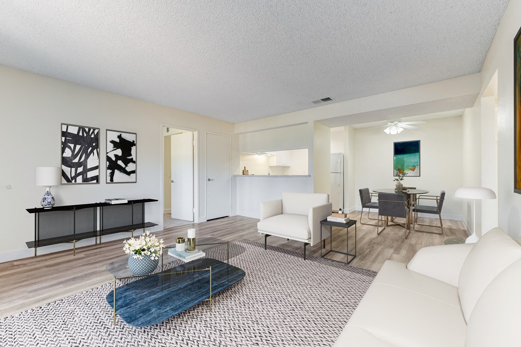 a living room with a white couch and a coffee table at Redlands Park Apts, California, 92373
