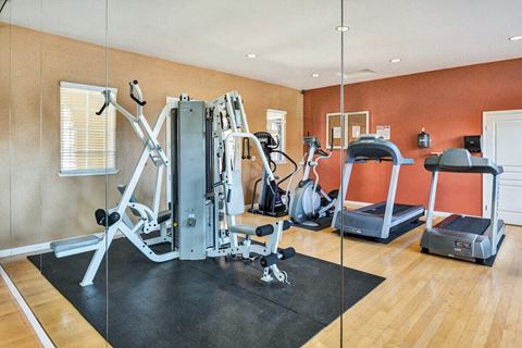 a home gym with a treadmill and weights  at Falcon Bridge at Gale Ranch, San Ramon