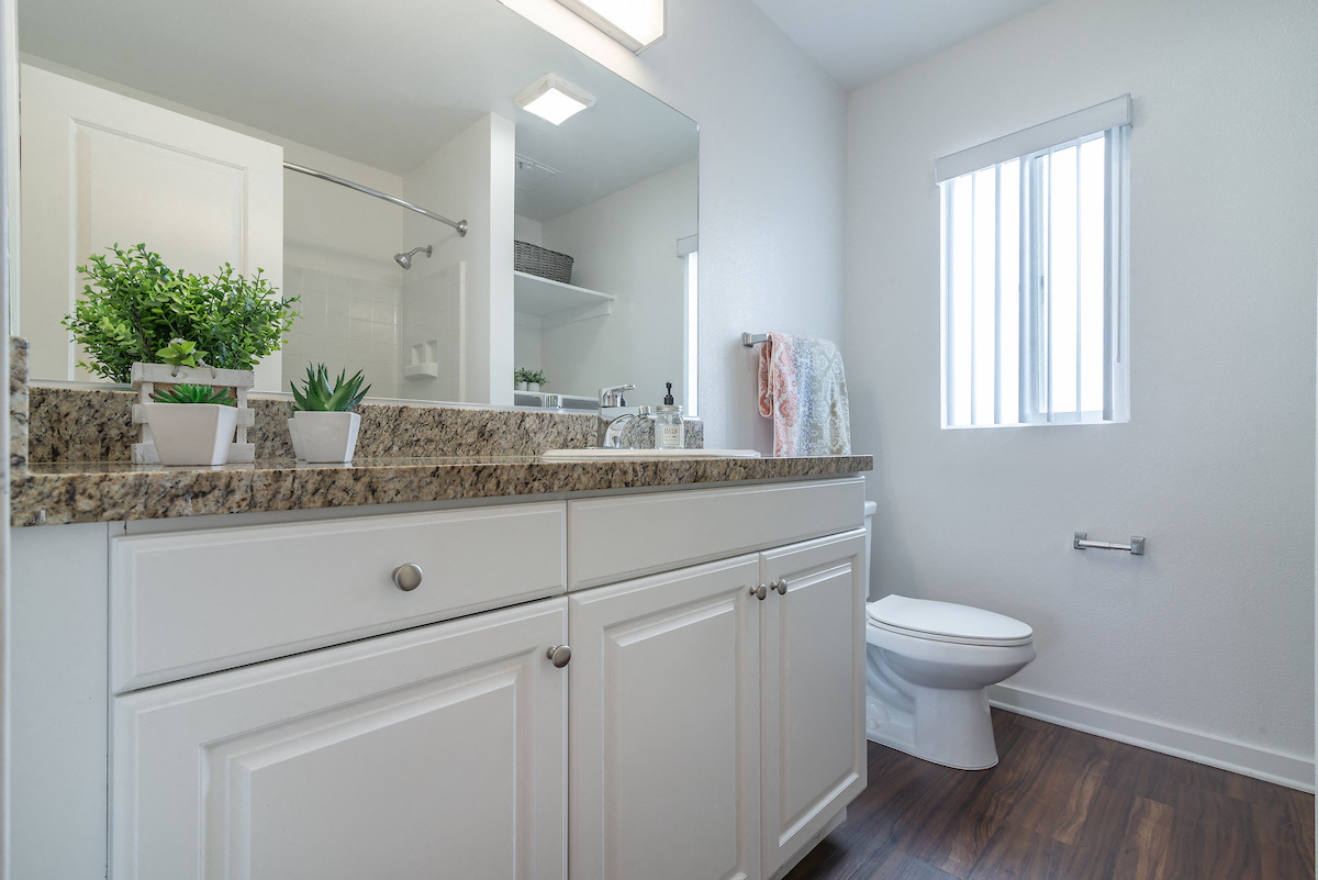 Renovated Bathrooms With Quartz Counters at Park Apartments, California, 90650