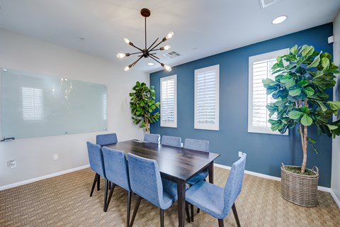 A conference room with a long table and chairs at Sonoma at Porter Ranch, CA, 91326
