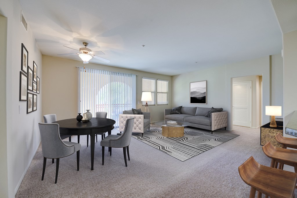 a living room with a table and chairs and a couch  at Sonoma at Porter Ranch, Porter Ranch, CA, 91326