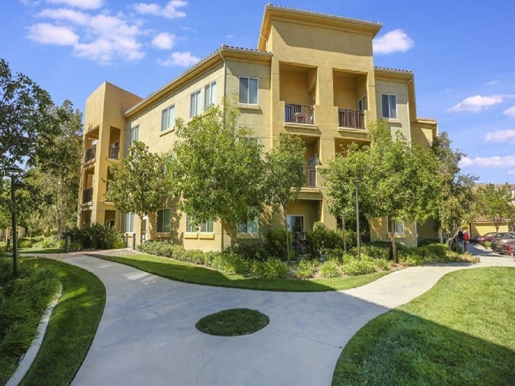 an exterior view of an apartment building  at Tesoro Senior Apartments, Porter Ranch, California