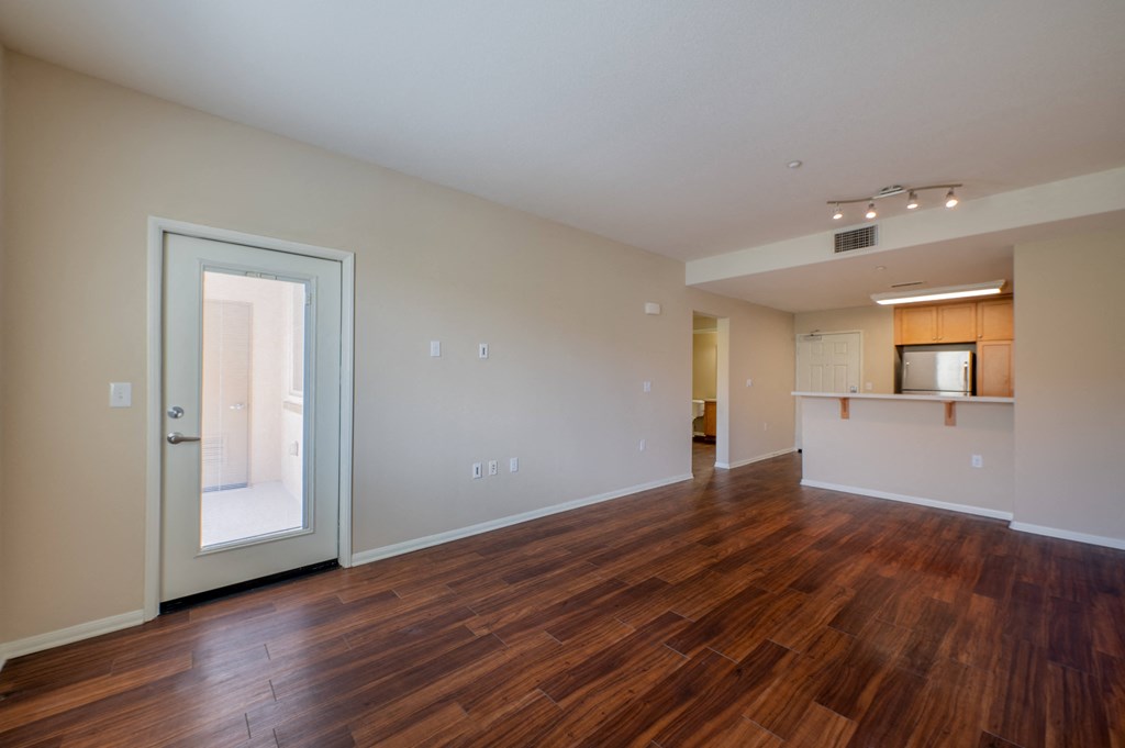 a living room and kitchen at the oxford at estonia apartments in san antonio  at Ventana Senior Apartments, Northridge, CA