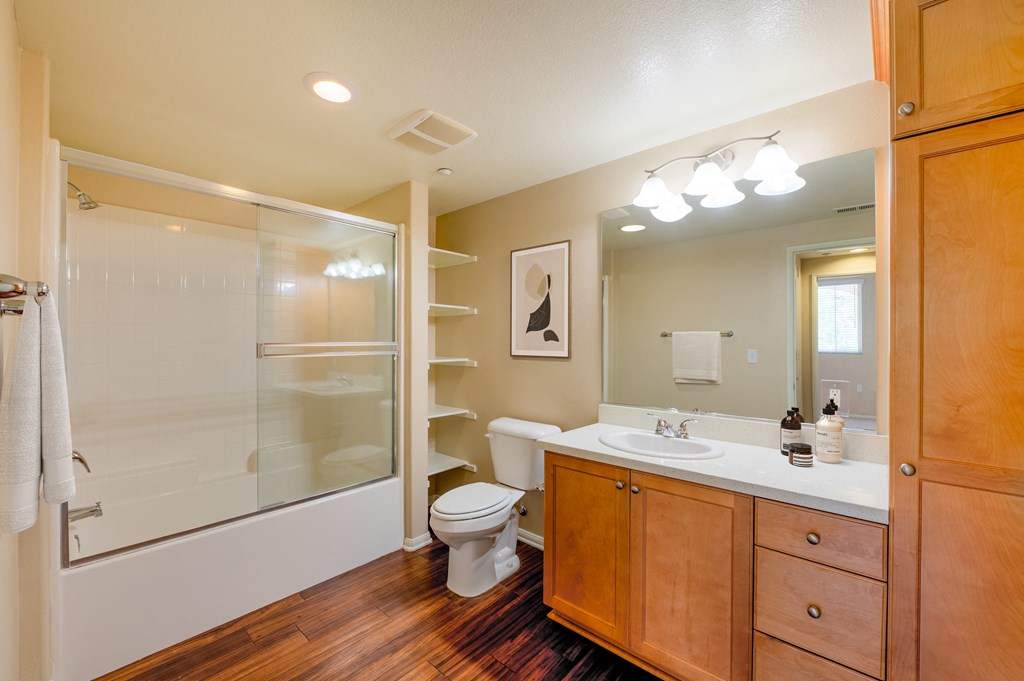 a bathroom with a toilet sink and shower  at Ventana Senior Apartments, Northridge, 91326