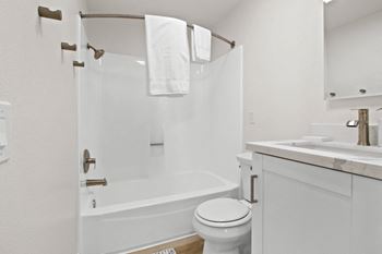 a bathroom with a bathtub and a sink at Harvard Manor, Irvine, 92612