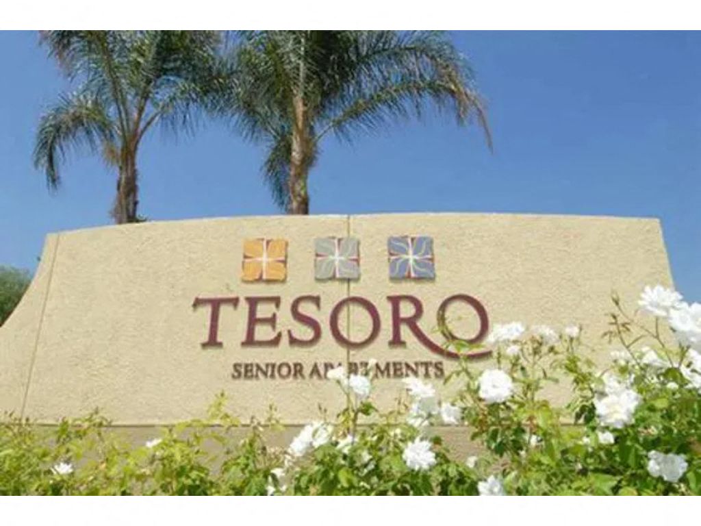 a sign that says tesoro senior apartments  at Tesoro Senior Apartments, Porter Ranch, CA
