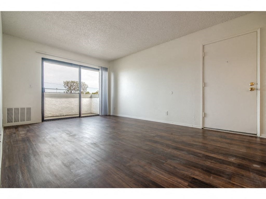 Living Area With Balcony at Costa Mesa Family Village, Costa Mesa, California