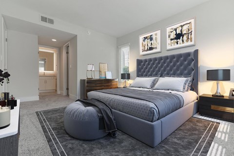 a bedroom with a bed and a dresser in a room  at Laguna Gardens Apts., California