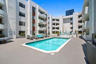 a pool is shown in front of an apartment building  at Masselin Park West, California, 90036 - Photo Gallery 4