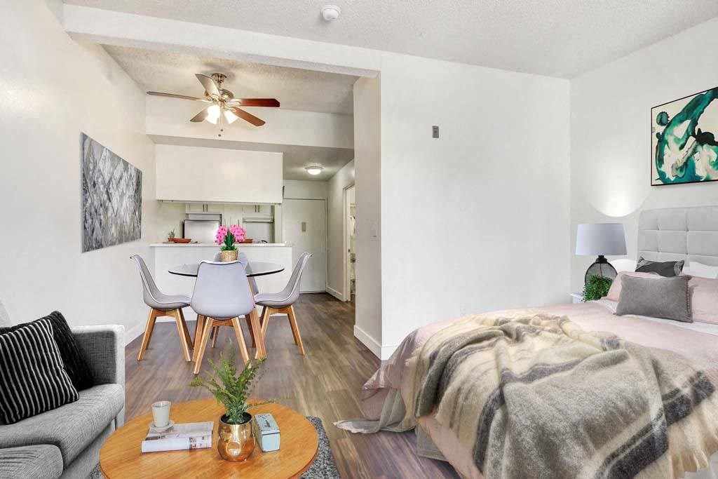 a bedroom with a bed and a ceiling fan  at Sherway Villa, Reseda, CA