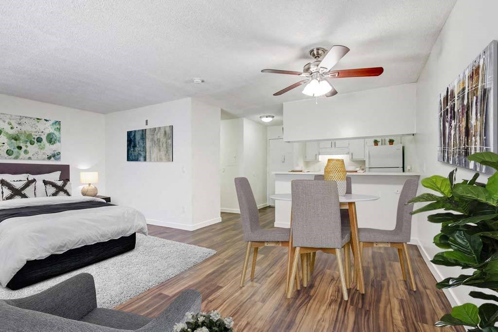 a bedroom with a bed and a ceiling fan and lamp  at Sherway Villa, California