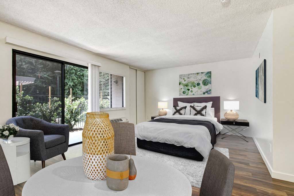 a bedroom with a table and chairs and a bed  at Sherway Villa, California, 91335