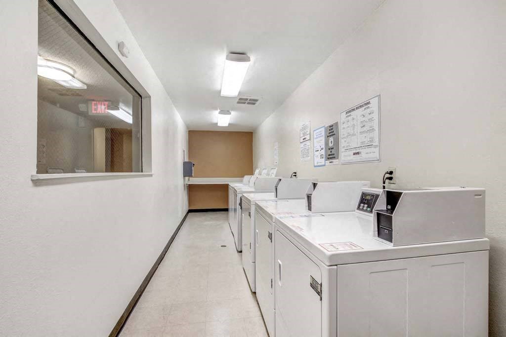 a washer and dryer in a room  at Sherway Villa, Reseda, 91335