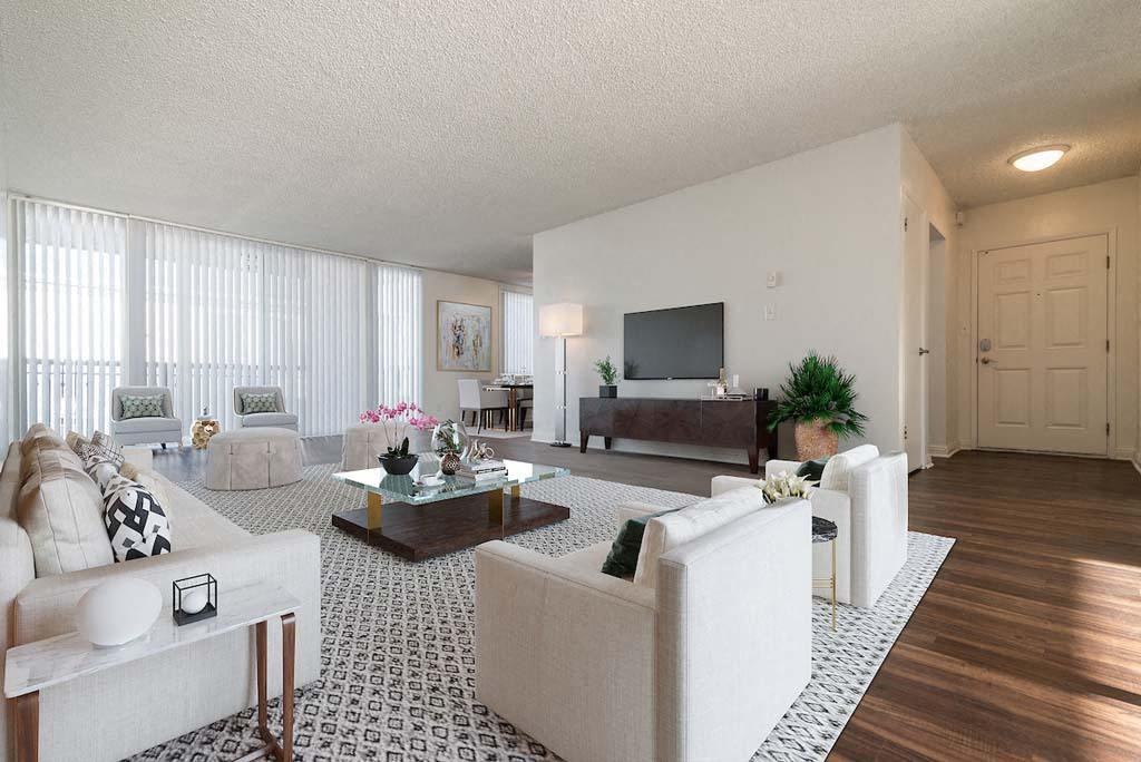 a living room filled with furniture and a flat screen tv at Park Avenue Apartments, Long Beach, CA