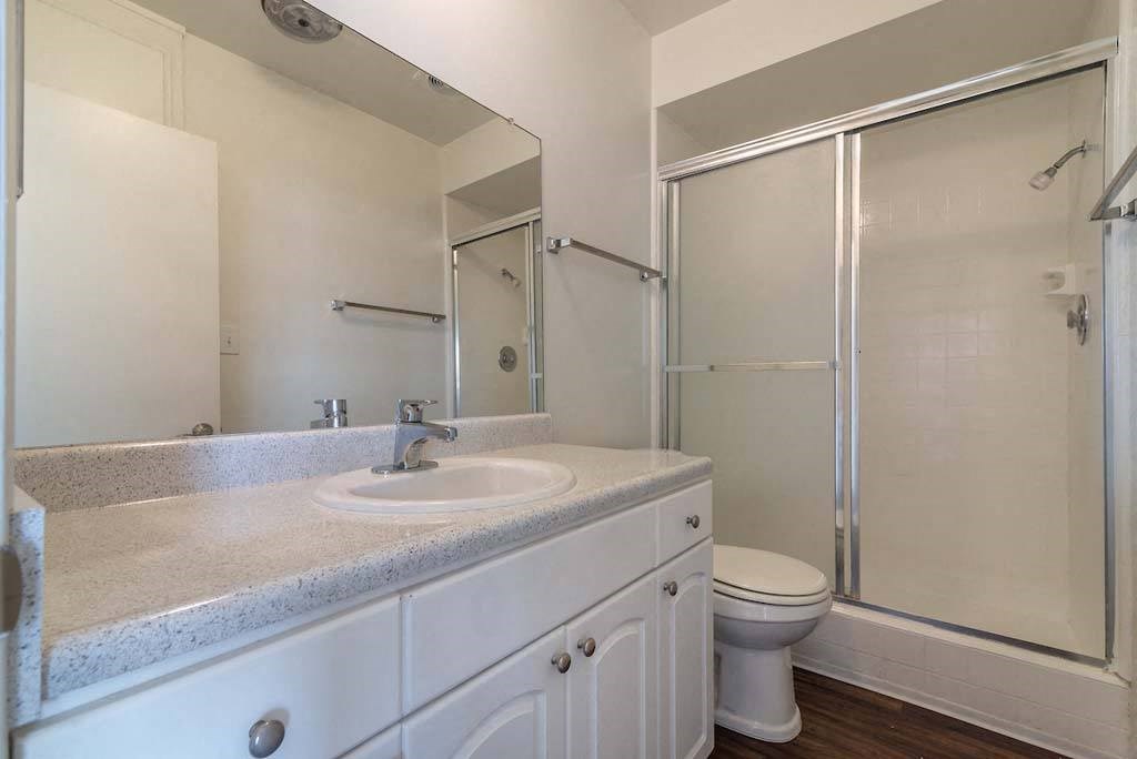 a bathroom with a sink toilet and shower at Park Avenue Apartments, Long Beach, California