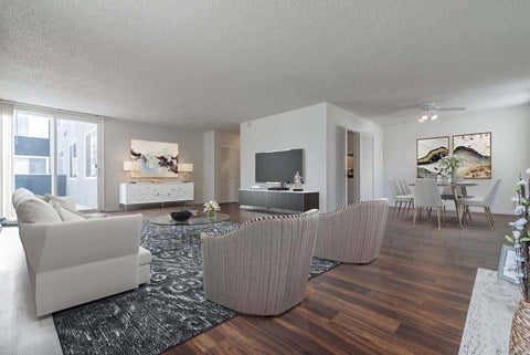 a living room filled with furniture and a flat screen tv at Park Avenue Apartments, Long Beach, CA