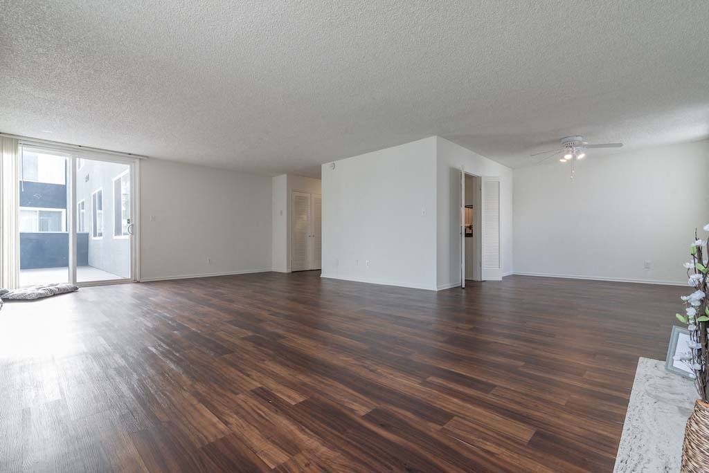 an empty living room with a hardwood floor at Park Avenue Apartments, Long Beach ,90815