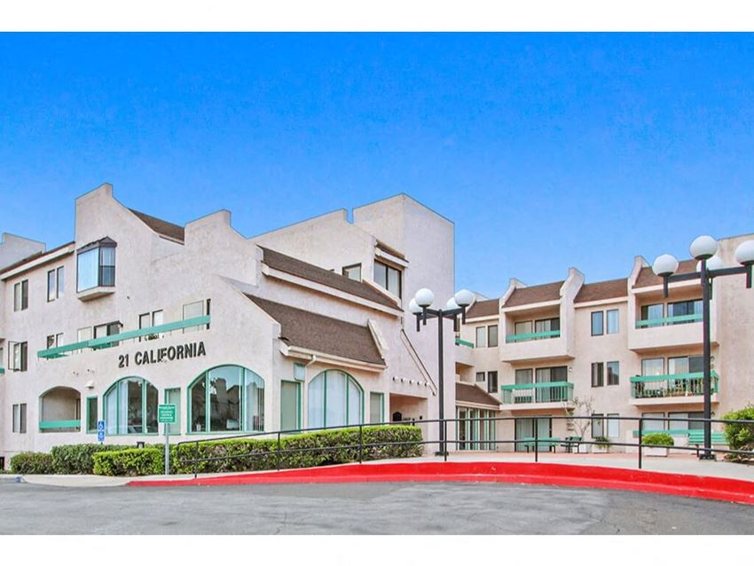 a building with a red circle in front of it a building with a red circle in front of it at Harvard Manor, Irvine, 92612 - Photo Gallery