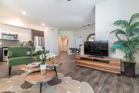 Living room, kitchen, and dining area at Montecito Apartments at Carlsbad, Carlsbad, CA