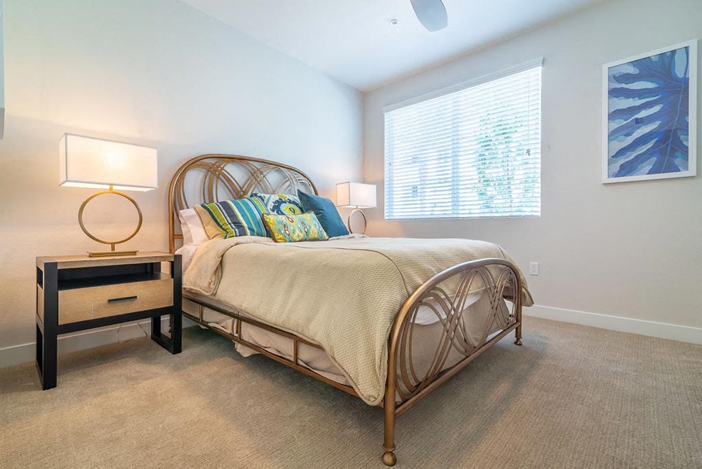 Bedroom with bed at Montecito Apartments at Carlsbad, California