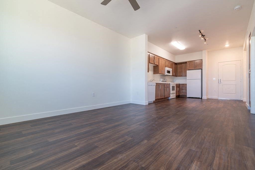 Kitchen and living room at Portola Senior Apartments, Carlsbad, CA, 92010