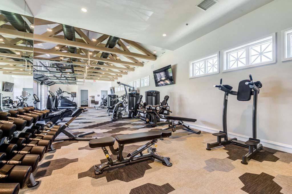 a spacious gym with treadmills and other exercise equipment at The Vineyards Apartments, Porter Ranch, 91326