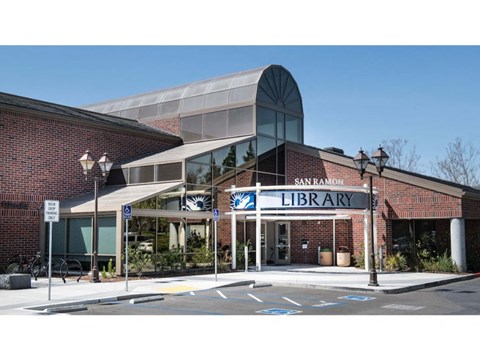 a large brick building with a sign that reads library