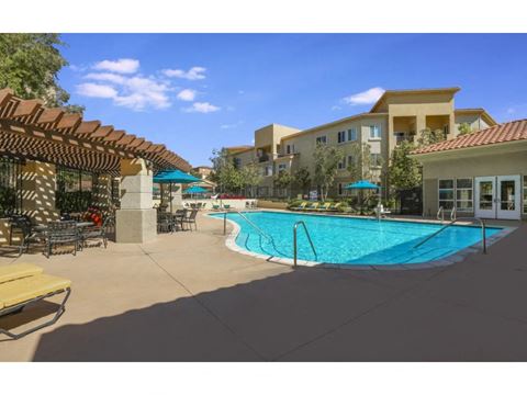 take a dip in our resort style swimming pool  at Tesoro Senior Apartments, Porter Ranch