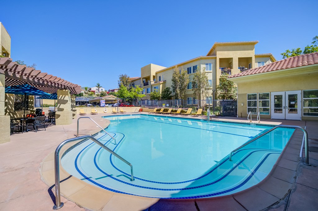 take a dip in our resort style swimming pool  at Tesoro Senior Apartments, Porter Ranch