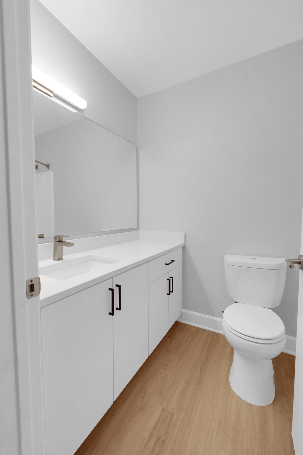 an empty bathroom with a toilet and a sink