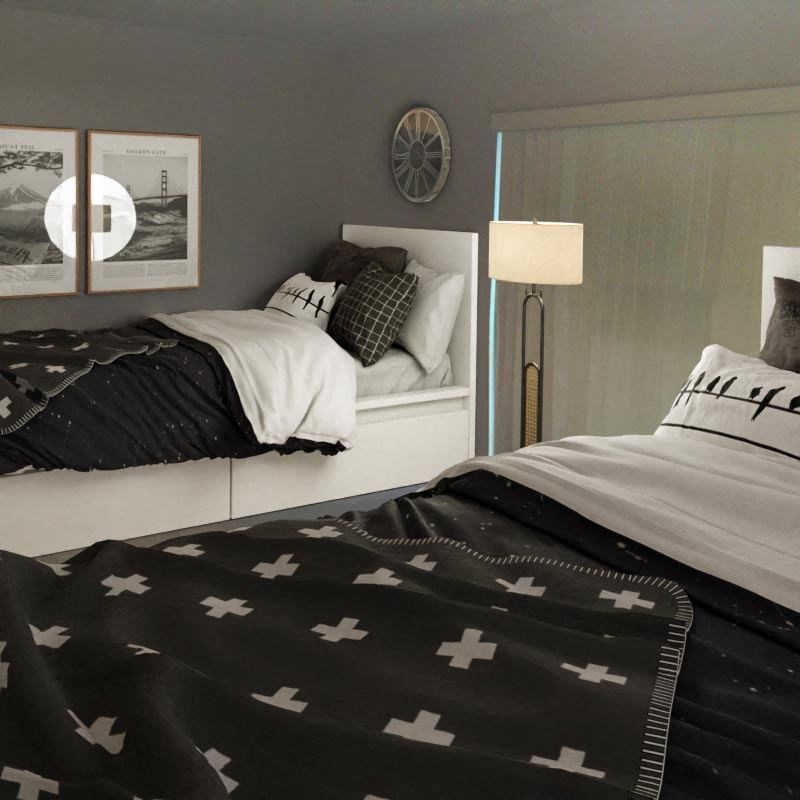 A bed with a black and white blanket and pillows. at 433 Midvale - Student Housing at UCLA, Los Angeles, CA