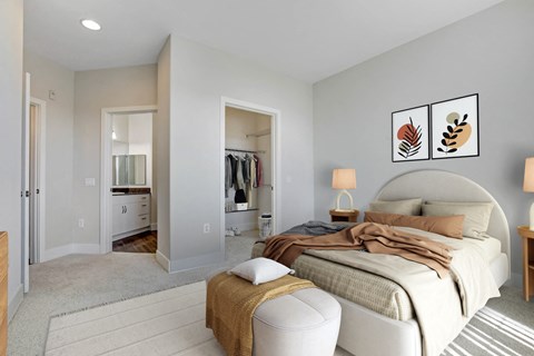 A bedroom with a large bed and a wardrobe. at Apex Mission Valley, San Diego, CA